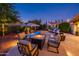 Cozy fire pit surrounded by comfortable seating for outdoor gatherings at 22012 N Arrellaga Dr, Sun City West, AZ 85375