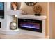 Modern electric fireplace with decorative mantel at 22012 N Arrellaga Dr, Sun City West, AZ 85375