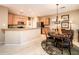 Kitchen with breakfast bar, ample cabinetry, and dining area at 22012 N Arrellaga Dr, Sun City West, AZ 85375