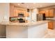 Modern kitchen with granite countertops and stainless steel appliances at 22012 N Arrellaga Dr, Sun City West, AZ 85375