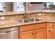 Kitchen with granite countertops and double sink at 22012 N Arrellaga Dr, Sun City West, AZ 85375