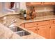 Kitchen with granite countertops and double sink at 22012 N Arrellaga Dr, Sun City West, AZ 85375