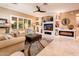 Living room with built-in entertainment center and fireplace at 22012 N Arrellaga Dr, Sun City West, AZ 85375