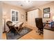 Home office with built-in cabinetry and hardwood floors at 22012 N Arrellaga Dr, Sun City West, AZ 85375