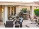 Outdoor patio with seating, grill, and dining area at 22012 N Arrellaga Dr, Sun City West, AZ 85375