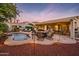 Spacious patio with a kidney-shaped pool and comfortable seating at 22012 N Arrellaga Dr, Sun City West, AZ 85375