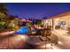 Serene pool area with fire pit and comfortable seating for evening relaxation at 22012 N Arrellaga Dr, Sun City West, AZ 85375