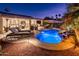 Expansive pool area with waterfall, comfortable seating, and a relaxing atmosphere at 22012 N Arrellaga Dr, Sun City West, AZ 85375