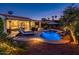 Stunning pool with a waterfall feature and plenty of seating for relaxation at 22012 N Arrellaga Dr, Sun City West, AZ 85375