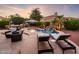 Enjoy this private oasis with a pool, patio furniture and fire pit at 22012 N Arrellaga Dr, Sun City West, AZ 85375