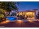 Stunning pool and patio area with comfortable seating and lighting at 22012 N Arrellaga Dr, Sun City West, AZ 85375