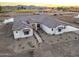 Aerial view of a new construction craftsman style home with tile roof at 22859 W Euclid Ave, Buckeye, AZ 85326