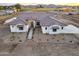 Aerial view of a new construction craftsman style home with tile roof at 22859 W Euclid Ave, Buckeye, AZ 85326