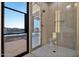 Bathroom with glass shower and view of backyard at 22859 W Euclid Ave, Buckeye, AZ 85326