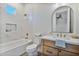 Bathroom with marble tile, modern vanity, and a bathtub at 22859 W Euclid Ave, Buckeye, AZ 85326