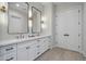 Modern bathroom with double vanity, large mirrors, and ample storage at 22859 W Euclid Ave, Buckeye, AZ 85326