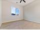 Bright bedroom with wood-look floors and large window at 22859 W Euclid Ave, Buckeye, AZ 85326