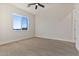 Well-lit bedroom featuring wood-look floors and a window at 22859 W Euclid Ave, Buckeye, AZ 85326