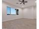 Bright bedroom with tile floors and a large window offering a view at 22859 W Euclid Ave, Buckeye, AZ 85326