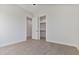 Spacious bedroom with wood-look floors and closet access at 22859 W Euclid Ave, Buckeye, AZ 85326