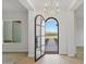 Open entryway with arched door and view of backyard at 22859 W Euclid Ave, Buckeye, AZ 85326