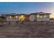 House exterior showcasing stone accents and landscaping at 22859 W Euclid Ave, Buckeye, AZ 85326