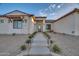 Front entrance with stonework, walkway, and landscaping at 22859 W Euclid Ave, Buckeye, AZ 85326