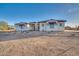 Single-story home with stone accents and a tile roof.Landscaped yard with walkway at 22859 W Euclid Ave, Buckeye, AZ 85326