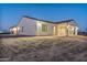 Well-lit, single-story home with a covered patio and desert landscaping at 22859 W Euclid Ave, Buckeye, AZ 85326