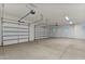 Spacious three-car garage with high ceilings and ample storage at 22859 W Euclid Ave, Buckeye, AZ 85326