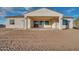 Back of house with covered patio and desert landscaping at 22859 W Euclid Ave, Buckeye, AZ 85326