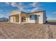 Back of house with covered patio and desert landscaping at 22859 W Euclid Ave, Buckeye, AZ 85326