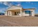 Back of house with covered patio and desert landscaping at 22859 W Euclid Ave, Buckeye, AZ 85326