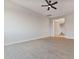 Spacious living area featuring wood-look tile floors and a ceiling fan at 22859 W Euclid Ave, Buckeye, AZ 85326