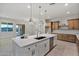 Modern kitchen with a large island and stainless steel appliances at 22859 W Euclid Ave, Buckeye, AZ 85326