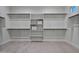 Bright walk-in closet with custom built-in shelving and hanging space at 22859 W Euclid Ave, Buckeye, AZ 85326