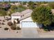 Single-story house with a two-car garage and mature landscaping at 2490 E Fiesta Dr, Casa Grande, AZ 85194