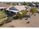 Backyard with covered patio, flagstone patio, and desert landscaping at 2490 E Fiesta Dr, Casa Grande, AZ 85194