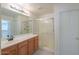 Bathroom features double sinks, wood cabinets, and a shower at 2490 E Fiesta Dr, Casa Grande, AZ 85194