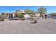 House exterior showcasing desert landscaping and a covered patio at 2490 E Fiesta Dr, Casa Grande, AZ 85194