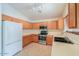 View of kitchen with stainless steel appliances and wood cabinets at 2490 E Fiesta Dr, Casa Grande, AZ 85194