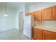 Kitchen area with wood cabinets and stainless steel appliances at 2490 E Fiesta Dr, Casa Grande, AZ 85194