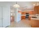 Kitchen with light wood cabinets, stainless steel appliances, and tile flooring at 2490 E Fiesta Dr, Casa Grande, AZ 85194