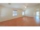 Spacious living area with hardwood floors and ceiling fan at 2490 E Fiesta Dr, Casa Grande, AZ 85194