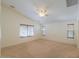 Spacious living room with carpeting, ceiling fan, and large windows at 2490 E Fiesta Dr, Casa Grande, AZ 85194