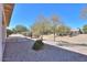 Covered patio with flagstone flooring and desert landscape at 2490 E Fiesta Dr, Casa Grande, AZ 85194