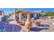 Relaxing backyard with patio furniture and fire pit at 26409 S Moonshadow Dr, Sun Lakes, AZ 85248