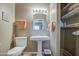 Bathroom with pedestal sink, toilet and linen closet at 26409 S Moonshadow Dr, Sun Lakes, AZ 85248