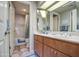 Bathroom with double vanity, tub and shower at 26409 S Moonshadow Dr, Sun Lakes, AZ 85248