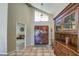 Interior entryway with tile floors and wooden hutch at 26409 S Moonshadow Dr, Sun Lakes, AZ 85248